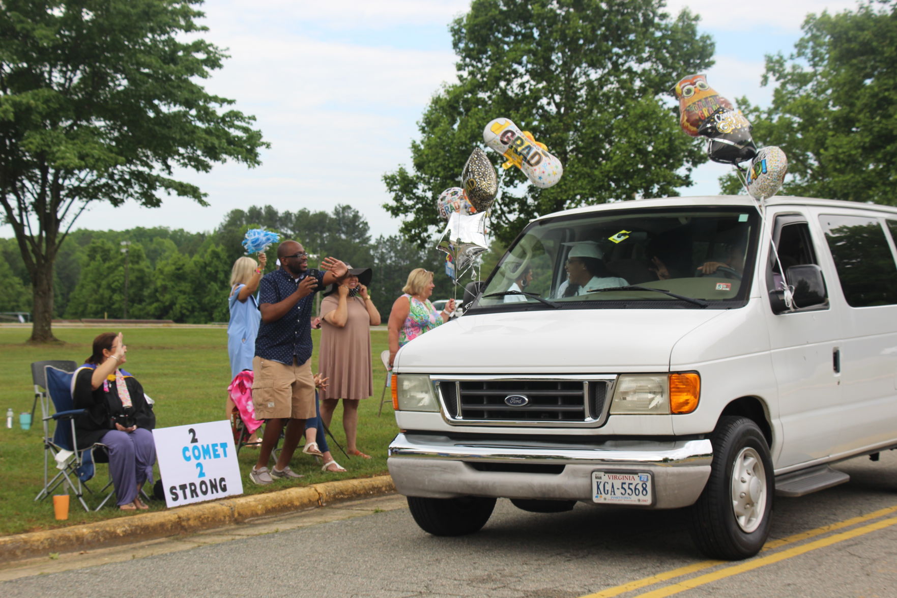 Staff congratulating students.JPG